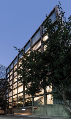 A modern building with a grid of windows and a sign reading "VOLGA". - Volga, Member of Preferred Hotels & Resorts (Mexico City)