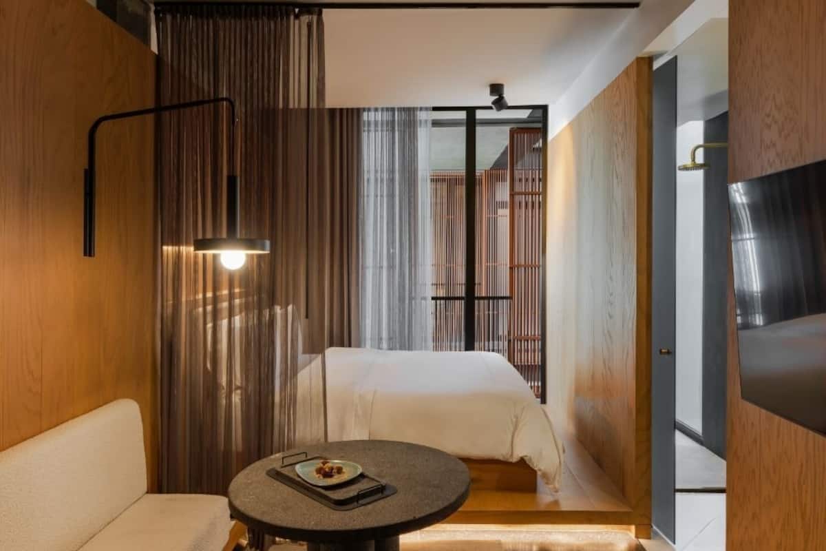 Deluxe Room, 1 Queen Bed | Living area | 50-inch Smart TV with cable channels, TV
