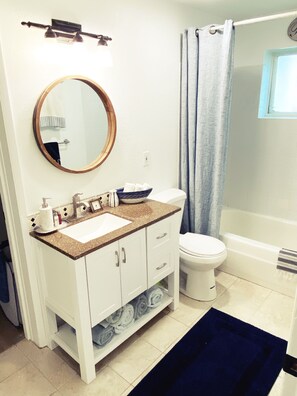 Combined shower/bathtub, hair dryer, towels, soap