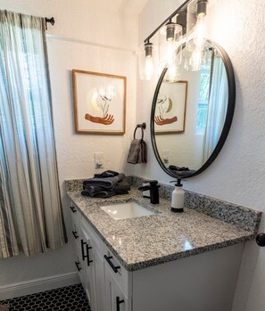 Combined shower/tub, hair dryer, towels, soap