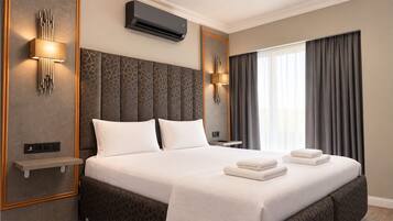 Deluxe Room | Laptop workspace, blackout drapes, iron/ironing board (on request)