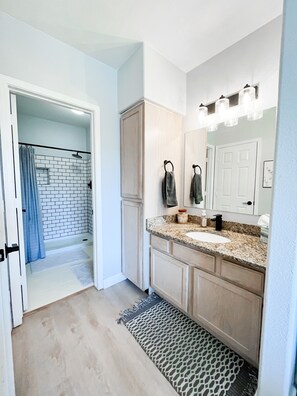 Combined shower/bathtub, hair dryer, towels, toilet paper