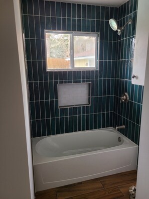Combined shower/tub, hair dryer, towels, soap