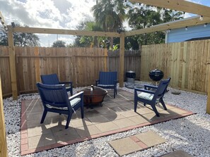 Relax outdoors with a barbecue grill and comfortable seating for four.