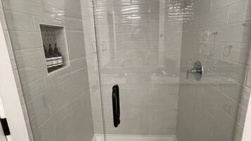 Bathtub, hair dryer, towels, soap