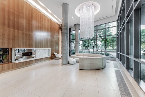 Elegant Downtown Oasis with City and Lake Views Plus Parking!