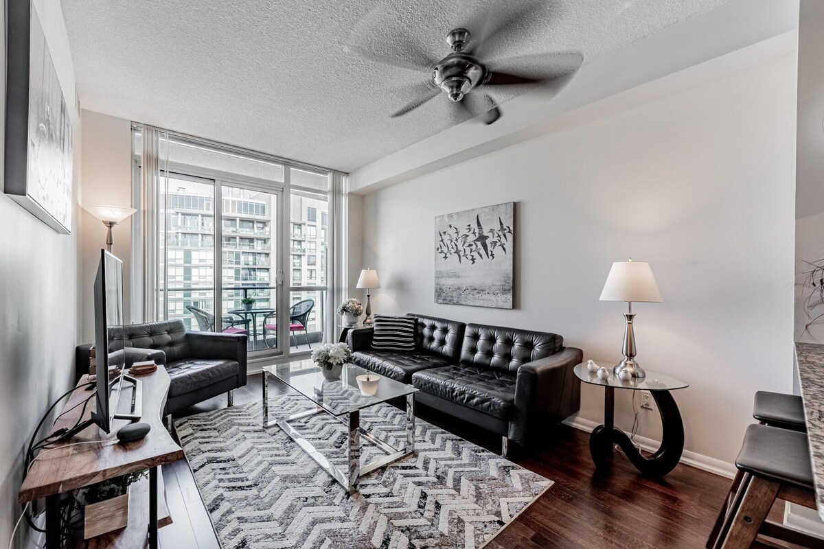Elegant Downtown Oasis with City and Lake Views Plus Parking!