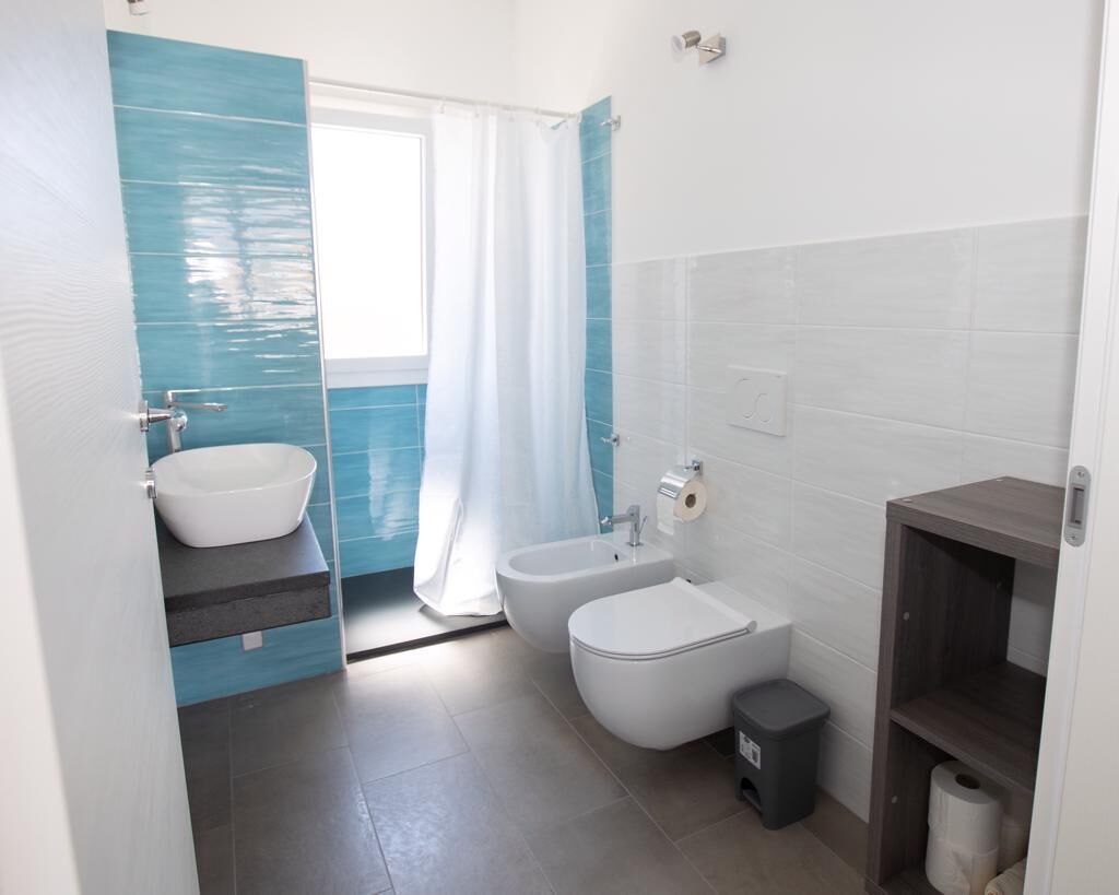 Modern and brand new apartment in a villa five minutes from the sea and the center