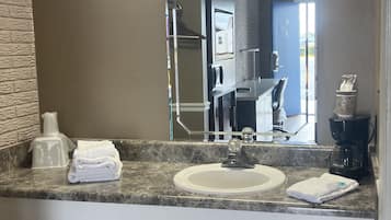 Combined shower/tub, hair dryer, towels, soap