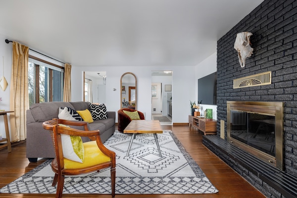 Living room. Kitchen and bedroom in background.