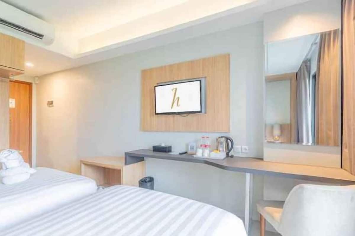 Premium bedding, pillow-top beds, desk, free WiFi