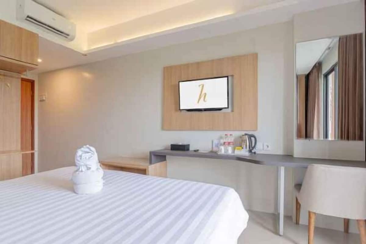 Premium bedding, pillow-top beds, desk, free WiFi