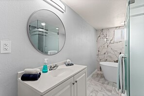 Bathtub, hair dryer, towels, soap