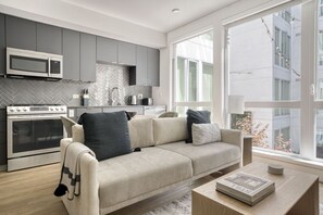 TV, stereo - Charming Oakland Studio w/ Coworking & Gym, near BART, by Blueground (Oakland)