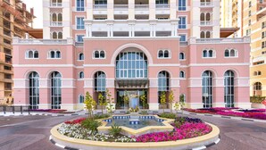 A hotel with a central fountain, large arched windows, and a symmetrical facade. - VB22 & VB23 by Qatar Coral (Doha)