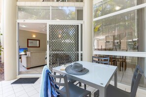 Enjoy a tranquil retreat with an outdoor area, comfortable seating, and a spacious desk for work or relaxation.