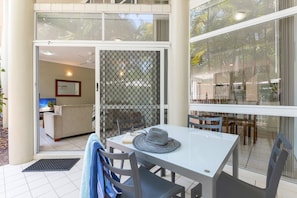 Enjoy a tranquil retreat with an outdoor area, comfortable seating, and a spacious desk for work or relaxation.
