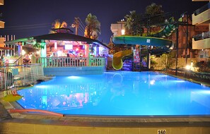 A swimming pool with a water slide and a bar area. - MAXWELL HOLIDAY CLUB (Marmaris)
