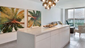 A modern kitchen with a central island, large windows, and a city view. - Beach front 2/1.5 luxuriously renovated space NEW! Rare find ... (Hollywood)