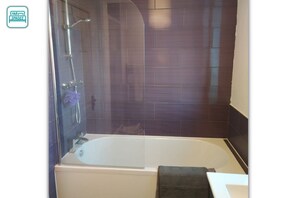 Combined shower/tub, hair dryer, towels, toilet paper