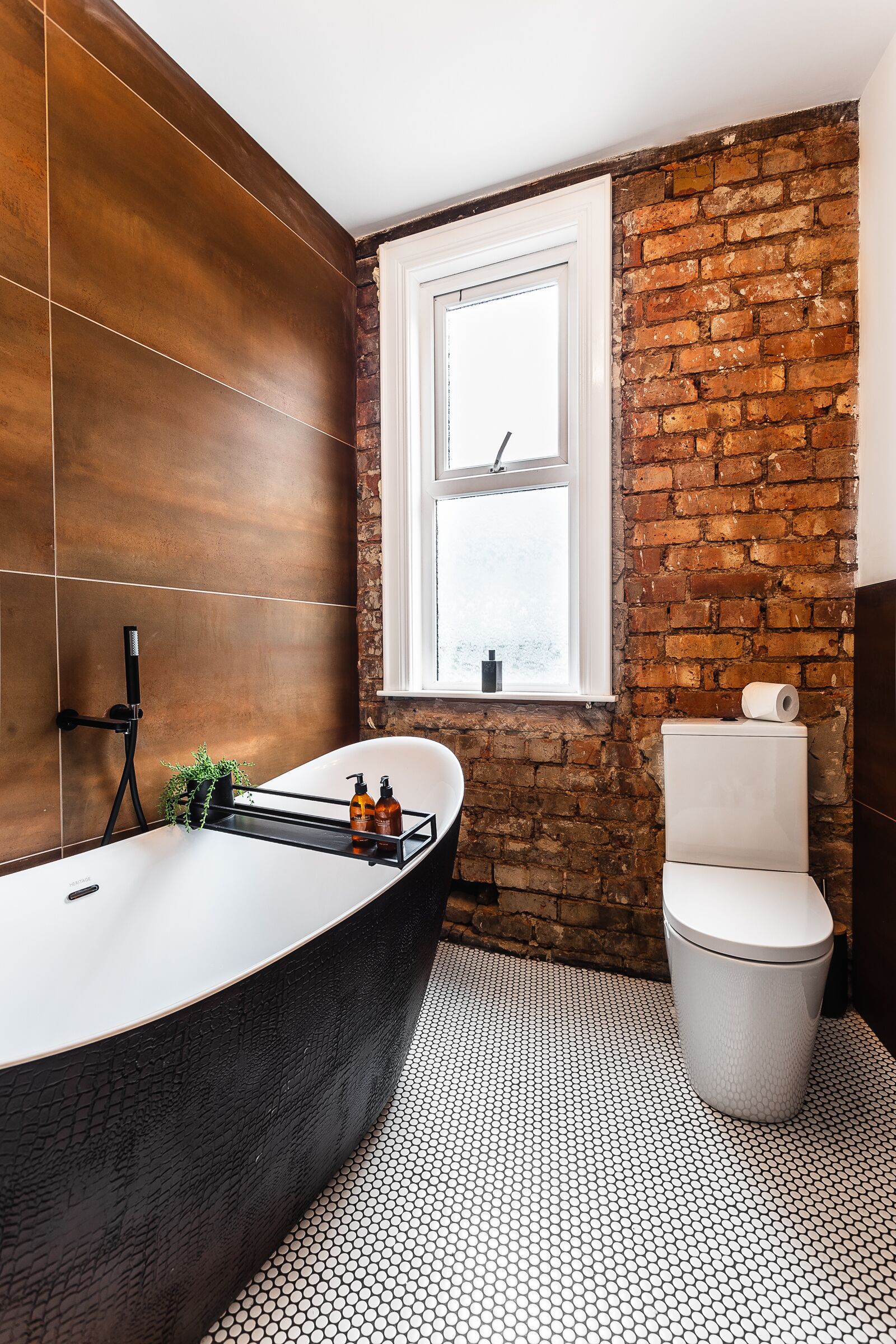 Bathtub, towels, toilet paper