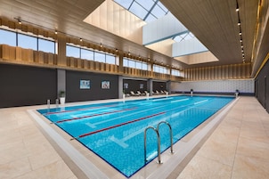 Indoor pool, open 7:00 AM to 10:00 PM, sun loungers, lifeguards on site
