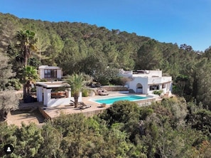 A villa with a swimming pool surrounded by lush greenery and hills. - LOOK NO FURTHER! Gorgeous old finca with sea view! (Sant Joan de Jabritja)
