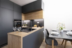 Apartament superior | Zona de menjador de l'habitació