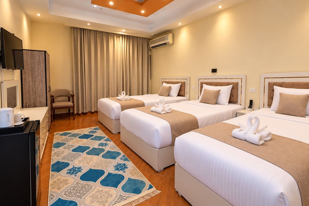 Triple Room, Multiple Beds, Private Bathroom, Tower | Egyptian cotton sheets, premium bedding, pillow-top beds, minibar