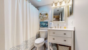 Combined shower/tub, hair dryer, towels, soap