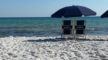 On the beach, sun-loungers