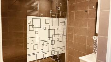Shower, hair dryer, towels, toilet paper