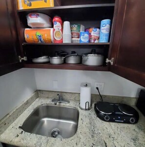 Fridge, microwave, stovetop, coffee/tea maker