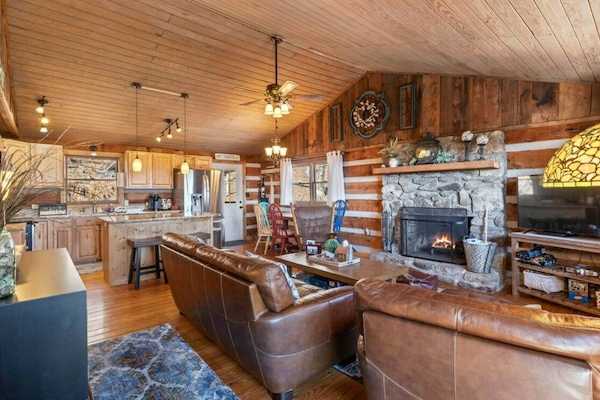 Large Living Room kitchen area with wood burning fireplace