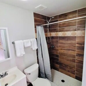 Shower, hair dryer, towels, soap