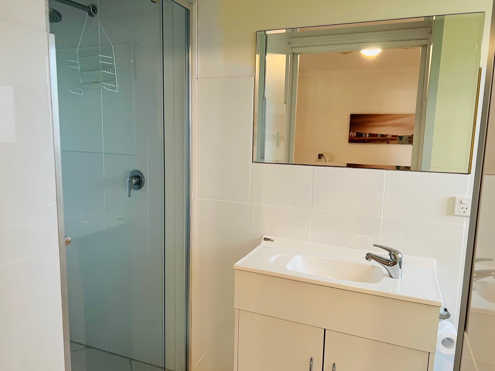 Bathtub, hair dryer, towels, shampoo