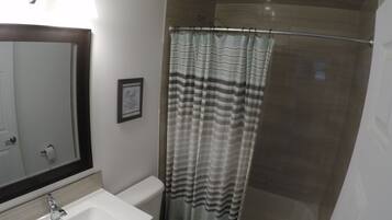 Combined shower/tub, hair dryer, towels, soap