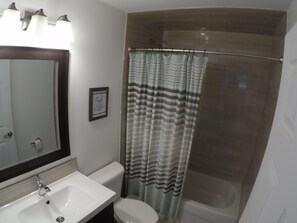 Combined shower/tub, hair dryer, towels, soap