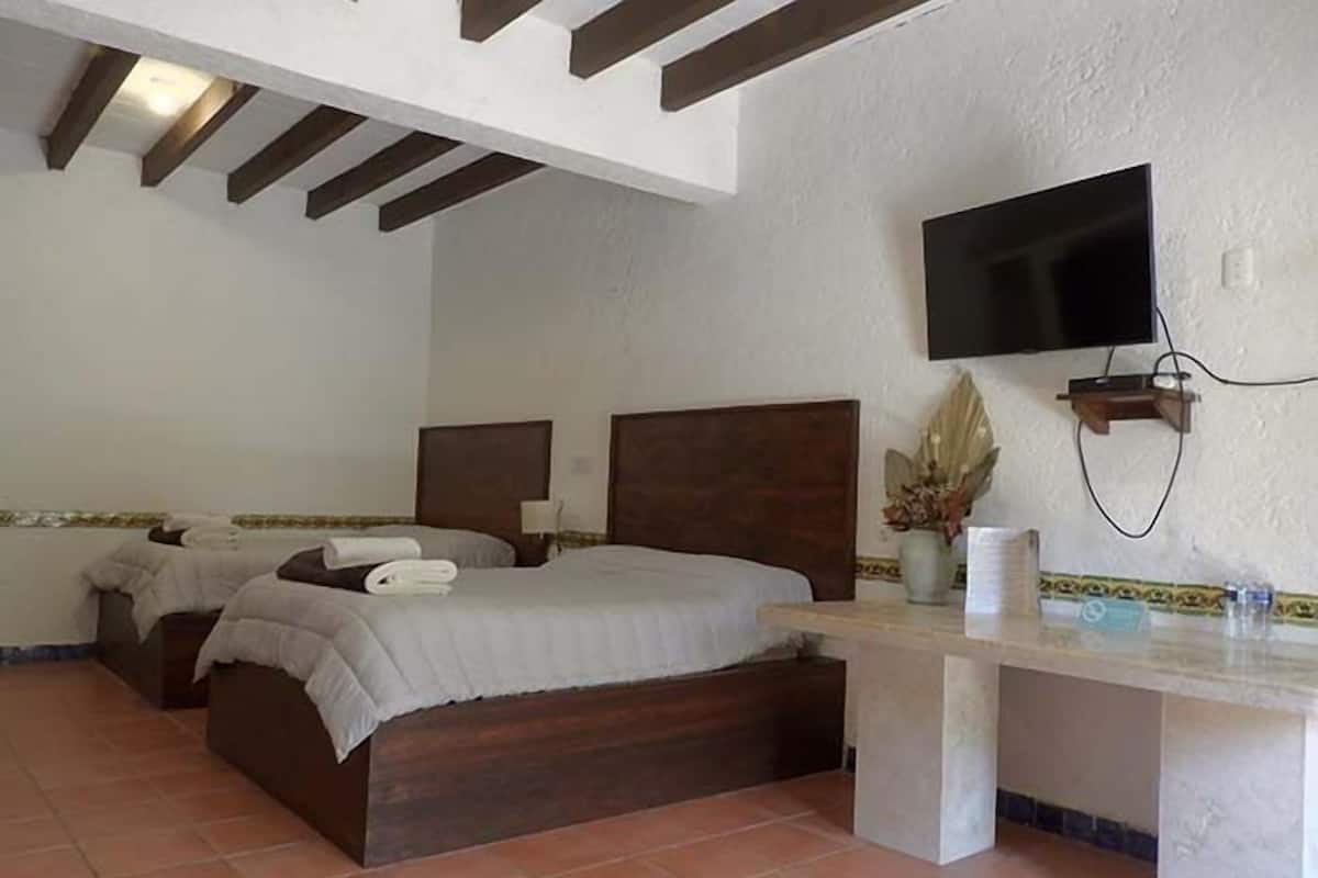 Quarto quádruplo luxo, vista para o jardim | Wi-Fi de cortesia, roupa de cama