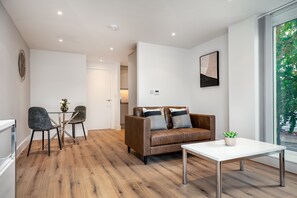 Standard Apartment | Living area | 43-inch Smart TV with digital channels, TV