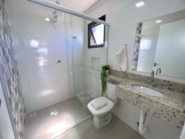 Standard Studio Suite | Bathroom | Shower, towels, soap, toilet paper