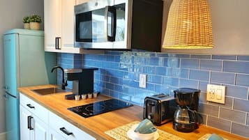 Microwave, stovetop, toaster, cookware/dishes/utensils