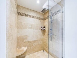 Shower, hair dryer, towels, shampoo
