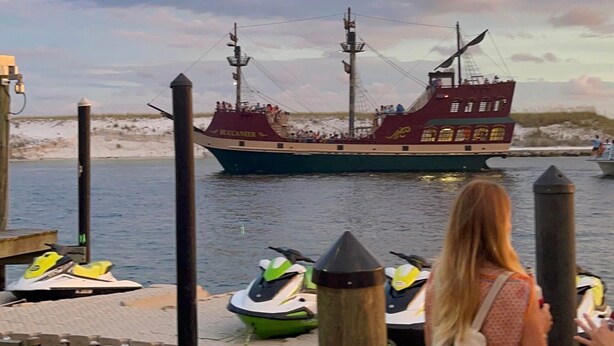 A dock with a ship named "EUCANIER" and jet skis. - New! GREEN HOUSE minutes from Navarre beach and restaurants (Navarre)