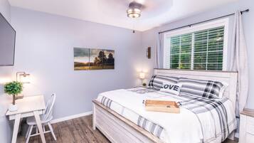 1 bedroom, desk, iron/ironing board, travel crib