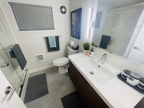 Bathtub, hair dryer, towels, soap