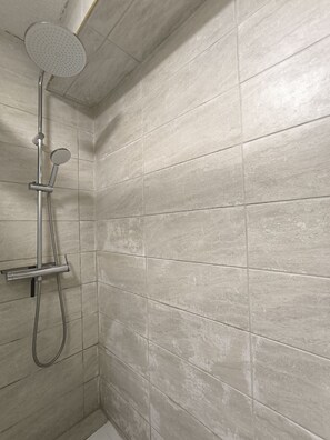 Shower, hair dryer, towels, toilet paper