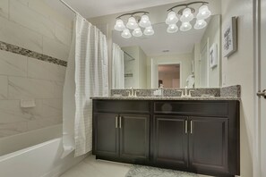 Hair dryer, towels, shampoo, toilet paper