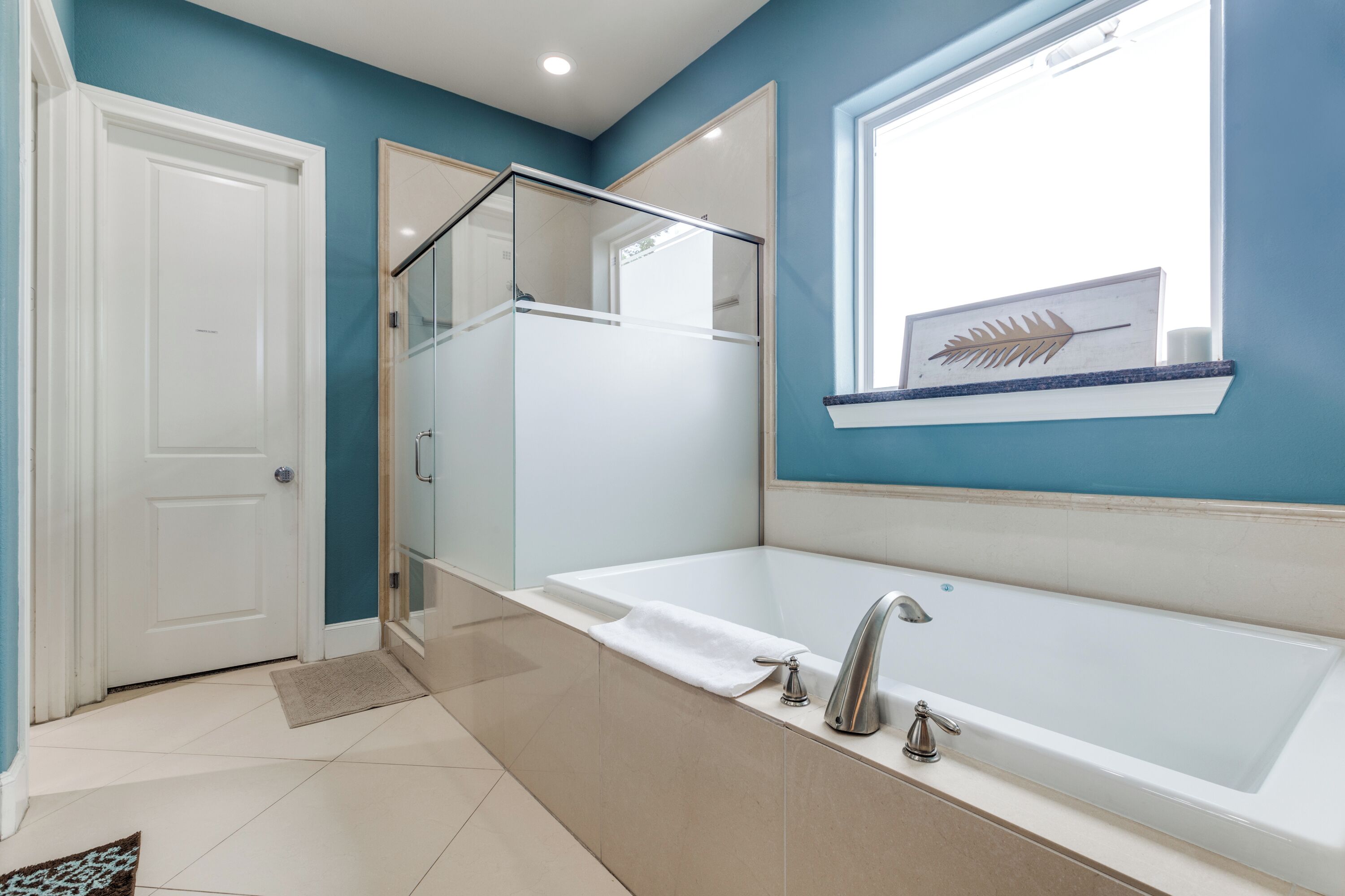 Combined shower/tub, hair dryer, towels, soap