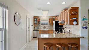 House, 3 Bedrooms | Private kitchen | Oven, dishwasher, dining tables - Belle Point by Sandy Beach Vacations (St. Pete Beach)